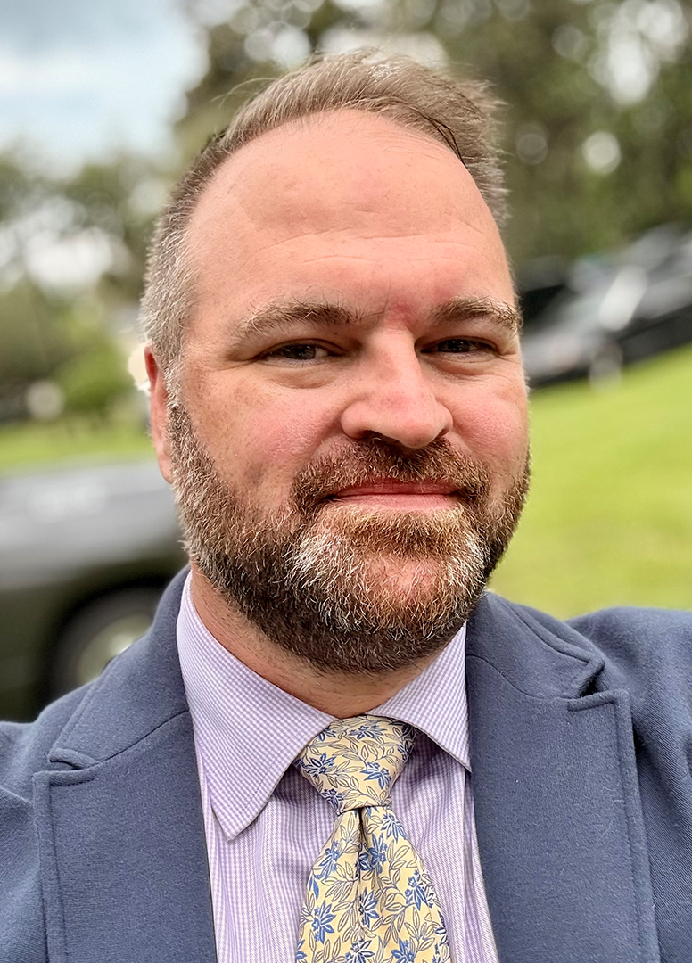Photo of Ben Tobias in a tie.